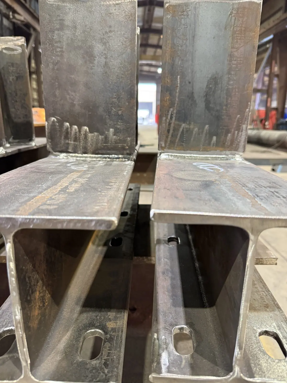 Two welded steel beam sections, end view